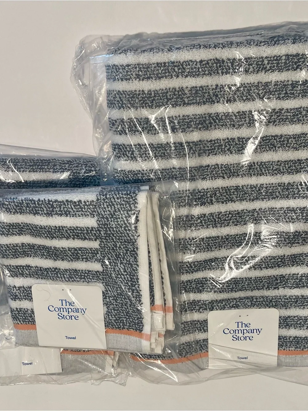 The Company Store 4 piece Navy & White Striped Towel set with Peach Accent